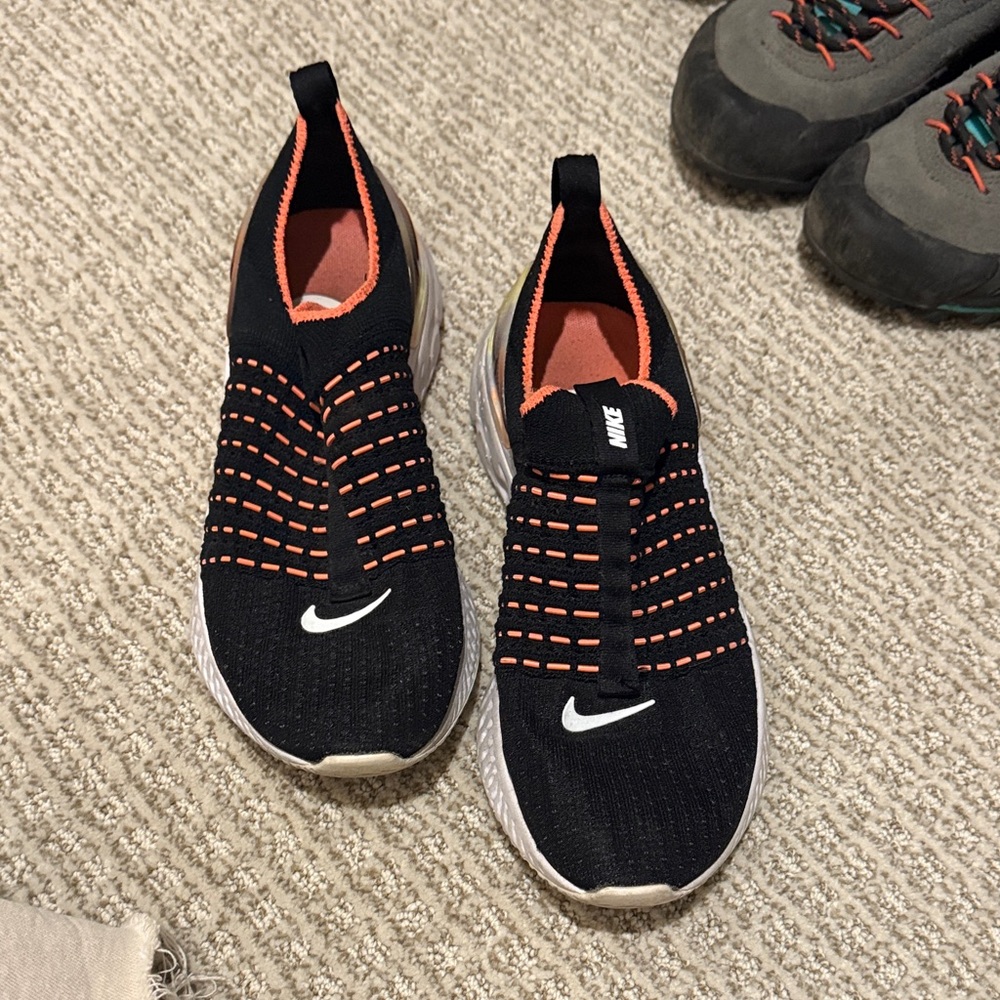 Nike Black and Orange Knit Slip-Ons